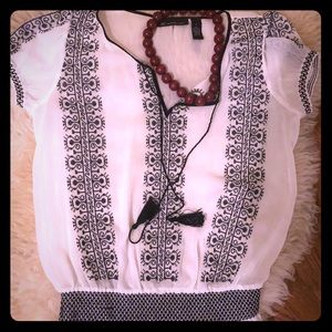 Bohemian-style white shirt with black embroidery
